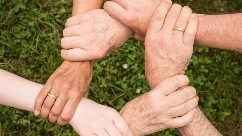 hands grasping wrists to make a circle