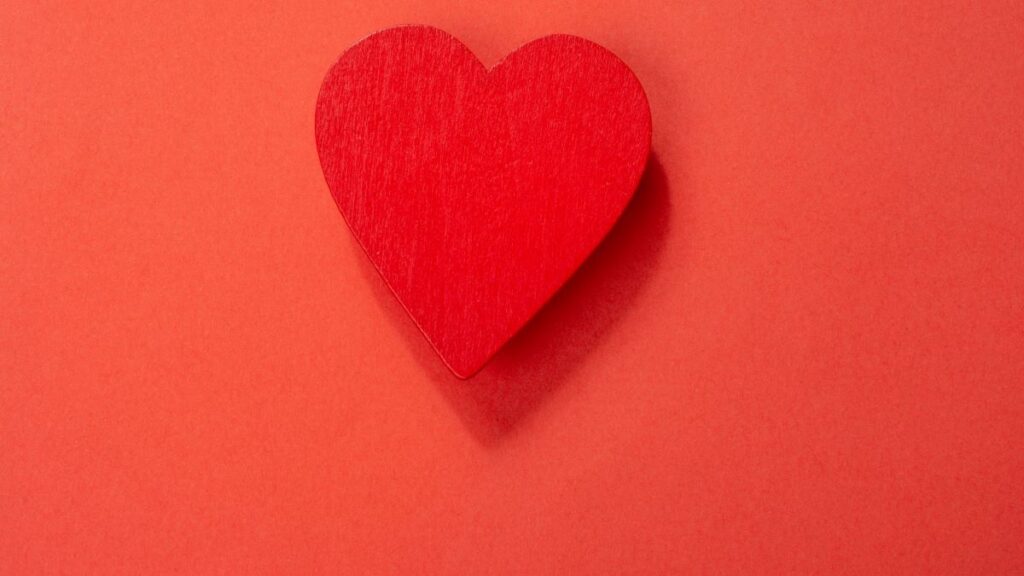 red heart on red background